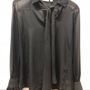 Black top with ruffle sleeves